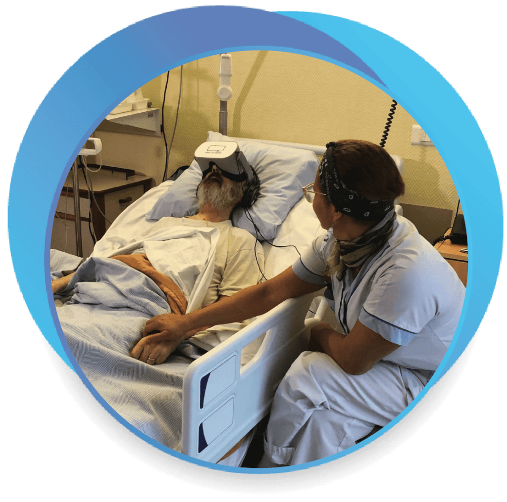 Photo of a patient using Healthy Mind therapeutic virtual reality accompanied by his palliative care nurse